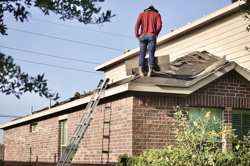 Professional roofer working on a residential roof in Robesonia